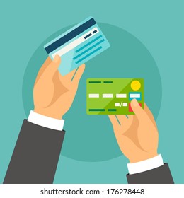 Hands holding bank cards in flat design style.