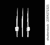 hands holding bars in a prison of darkness