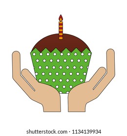 hands holding birthday cupcake with candle
