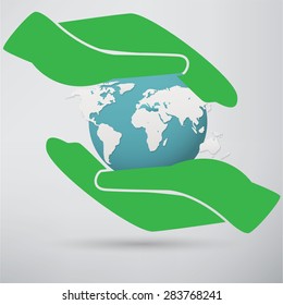 Hands holding a blue earth