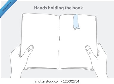 Manos sosteniendo el libro