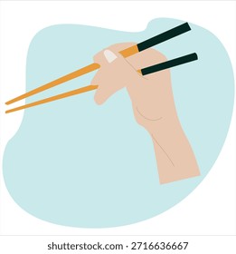 mãos segurando pauzinhos. A mão está manipulando habilmente um par de pauzinhos, 