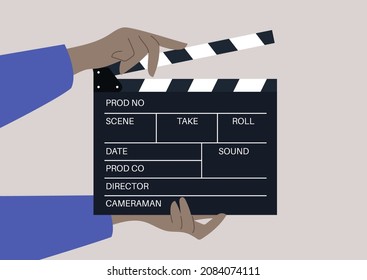 hands holding a clapperboard, a device used in filmmaking and video production to assist in synchronizing picture and sound