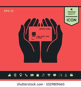Hands holding credit card. Icon