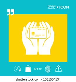 Hands holding credit card - icon