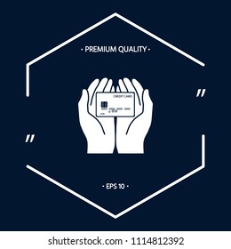 Hands holding credit card - icon