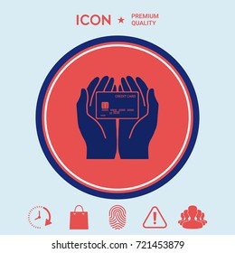 Hands holding credit card - icon