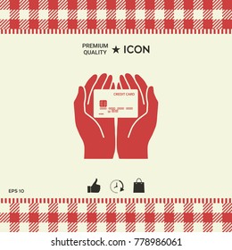 Hands holding credit card. Icon