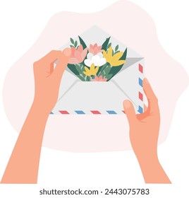  manos sosteniendo un sobre con flores