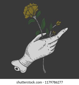 hands holding flowers black background