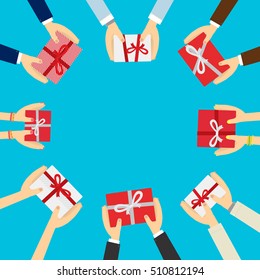 Hands holding a gift box isolated on blue background.