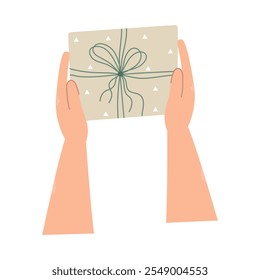Hands holding a gift box. Preparation for celebrating Christmas or New Year, birthday. Top view. Flat isolated vector illustration.