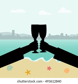 Hands holding glass of wine on beach background