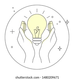 Hands holding a glowing light bulb. Saving power or electricity concept. 
