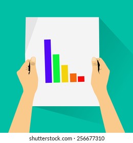 hands holding graph paper.