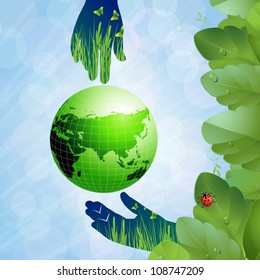Hands holding a green earth