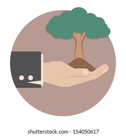 Hands holding a green tree , eps10 vector format