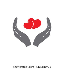 hands holding heart icon. Simple filled hands holding heart icon. On white background.