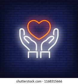 Hands holding heart neon sign. Medicine and health care concept. Advertisement design. Night bright neon sign, colorful billboard, light banner. Vector illustration in neon style.