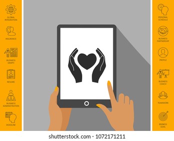 Hands holding heart symbol
