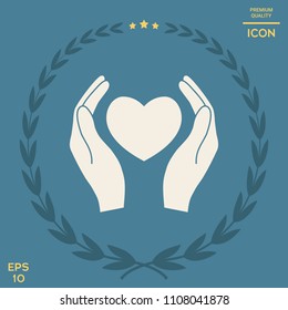 Hands holding heart symbol