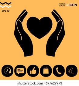 Hands holding heart symbol