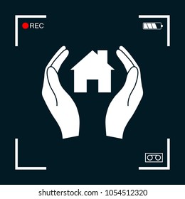 Hands holding home