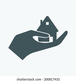 Hands holding home