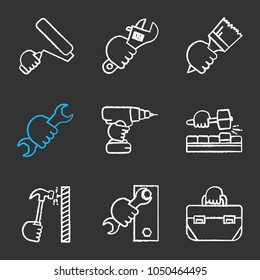 Hands holding instruments chalk icons set. Paint roller, plumbing wrench, brush, spanner, electric screwdriver, lump hammer, tool bag. Isolated vector chalkboard illustrations