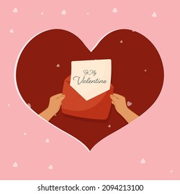 Hands Holding Love Letter Of Be My Valentine On Red Heart Shape And Pink Background.