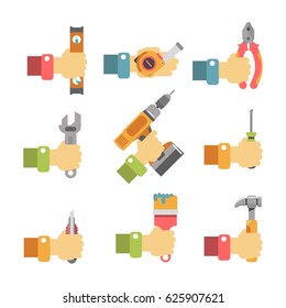 Hands holding maintenance tools
