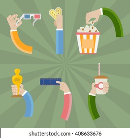 Hands holding movie icons. 