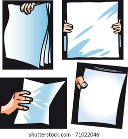 The hands holding a paper, are isolated on a black background