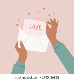 Hands holding paper of letter and many hearts concept. 