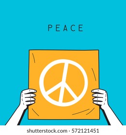 hands holding piece of paper with peace symbol
