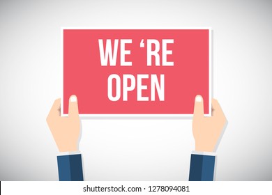 Hands holding placard with " WE 'RE OPEN " sign. Flat style vector illustration.