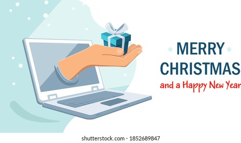 Hands holding a present as a concept of online holiday greetings horizontal banner template. Celebrating winter holidays remotely amid the coronavirus pandemic. New normal daily life realities.