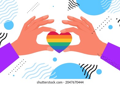 hands holding rainbow heart gay lesbian LGBT parade pride festival transgender love concept