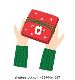 Hands holding a red gift box. Vector illustration on a white background. Concept for gifts, Christmas, New Year, holidays, birthday.