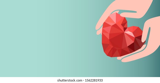 Hands holding red heart 