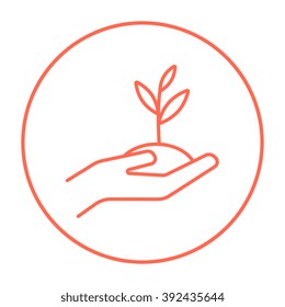 Hands holding seedling in soil line icon.