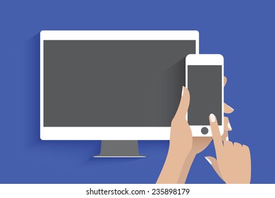 Hands holding smartphone with blank screen. Smartphone is connected to secondary display.