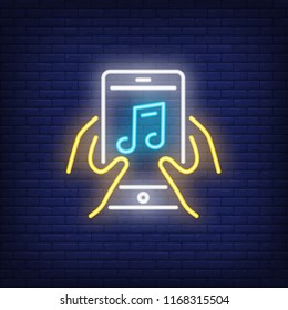 Hands holding smartphone with note neon sign. Music, technology and sound concept. Advertisement design. Night bright neon sign, colorful billboard, light banner. Vector illustration in neon style.