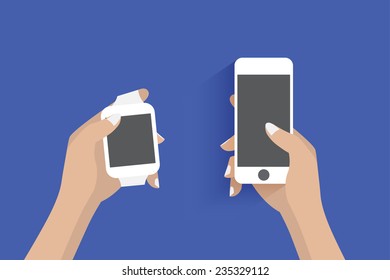 Hands holding smartphone and smart watch.