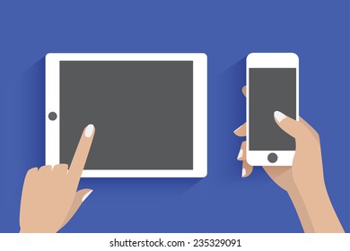 Hands holding smartphone and tablet computer.