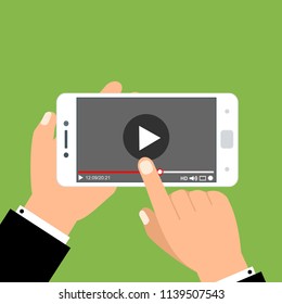 Hands holding smartphone and touching screen. Video player on screen. Vector illustration.