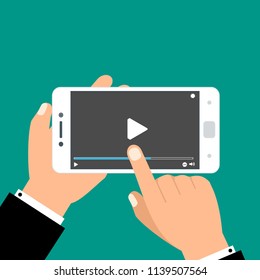 Hands holding smartphone and touching screen. Video player on screen. Vector illustration.