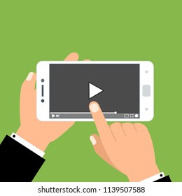 Hands holding smartphone and touching screen. Video player on screen. Vector illustration.