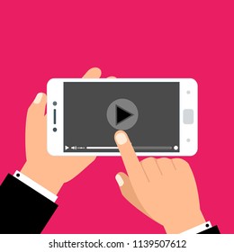 Hands holding smartphone and touching screen. Video player on screen. Vector illustration.