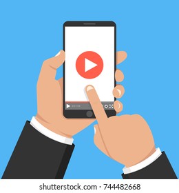 Hands holding smartphone and touching screen. Video player on screen. Vector illustration.